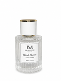 Blush Theory perfume bottle by E&A Signature Scent Co displayed elegantly, luxury women’s fragrance with floral apple scent notes including peony, jasmine, carnation, and rose.